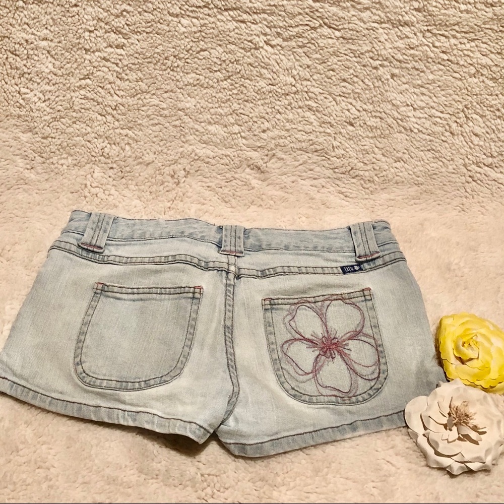 Light wash jean shorts with flower